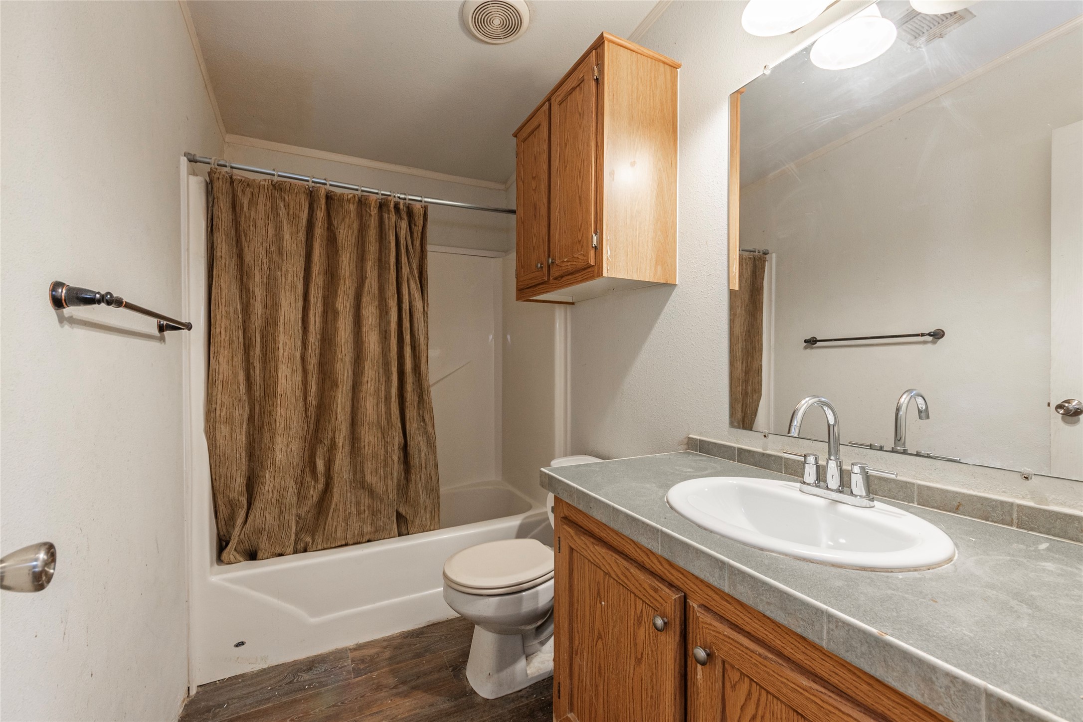 4624 6th Street Bacliff, TX 77518 - Photo 21 of 36 a bathroom with a sink toilet and shower