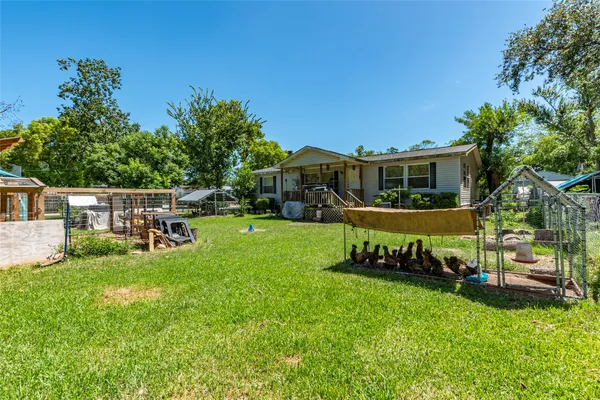 a view of a house with a yard porch and sitting area