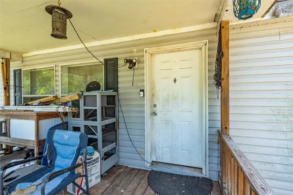 a view of front door and deck of the house