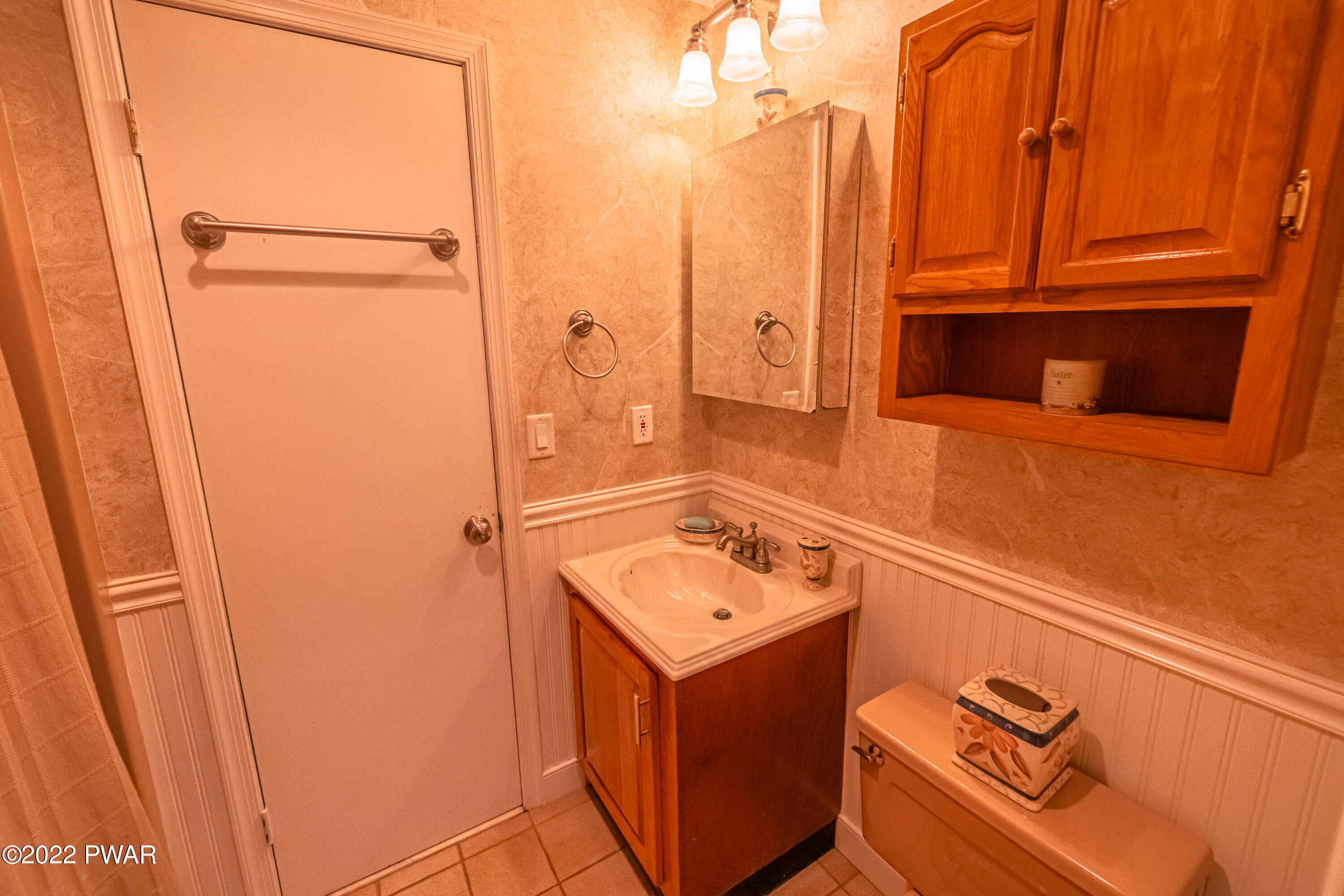 4141 Winchester Way Bushkill, PA 18324 - Photo 24 of 75 a bathroom with a sink a mirror and a shower
