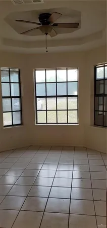 a view of an empty room with windows