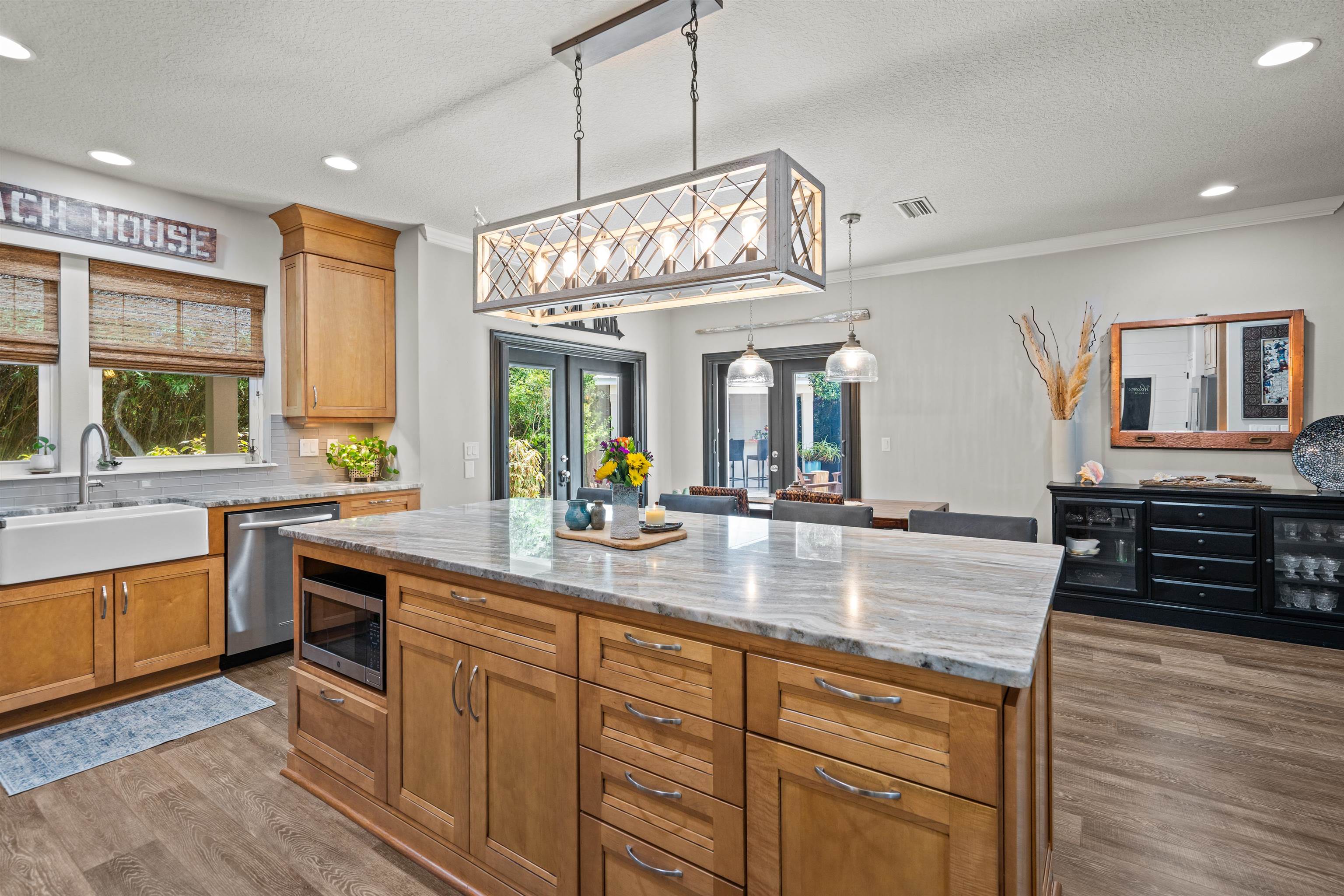 912 Sandy Beach Circle St. Augustine, FL 32080 - Photo 18 of 71 Kitchen with recessed lighting, a textured ceiling, appliances with stainless steel finishes, wood finished floors, and plenty of natural light