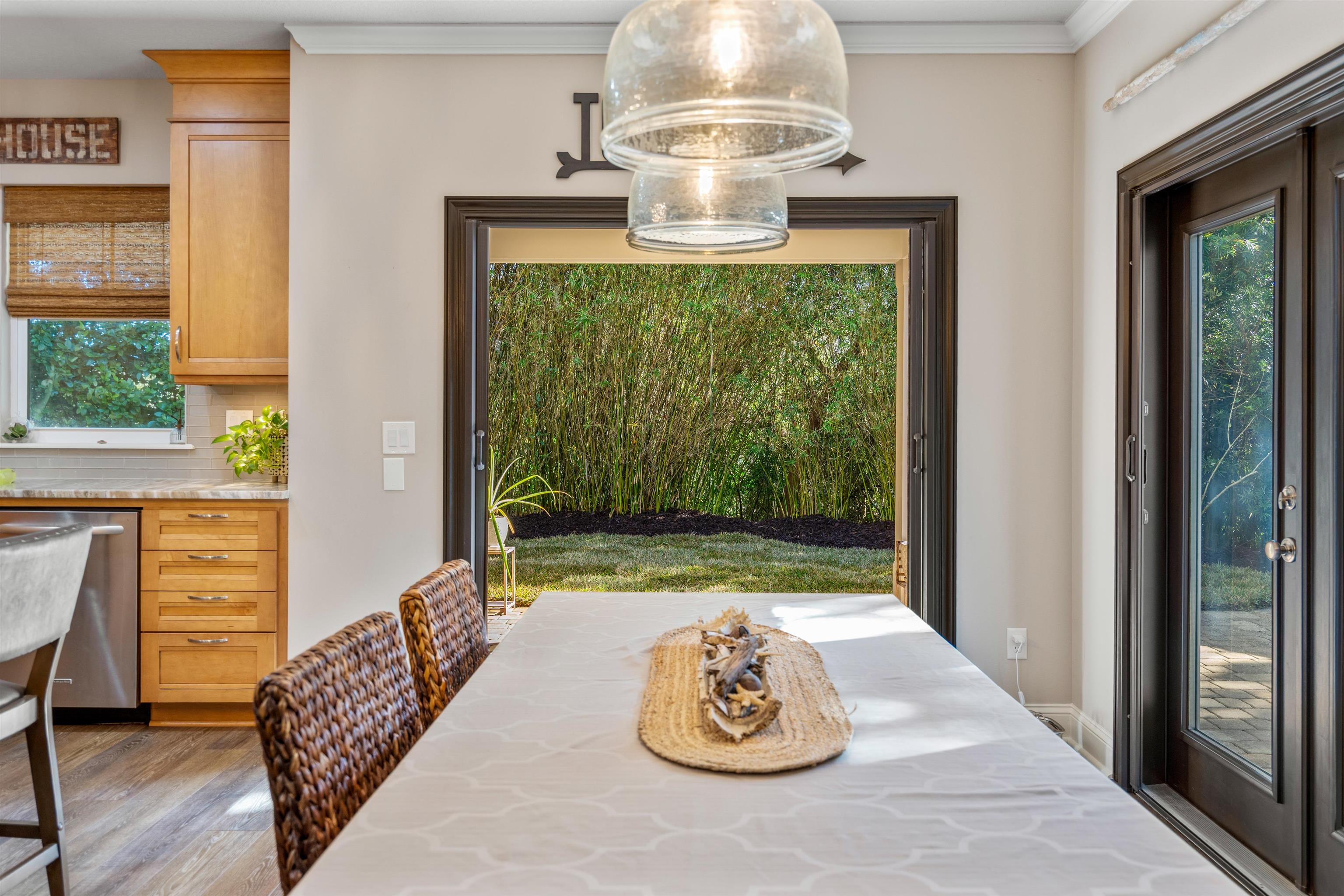 912 Sandy Beach Circle St. Augustine, FL 32080 - Photo 22 of 71 Dining area featuring wood finished floors and crown molding