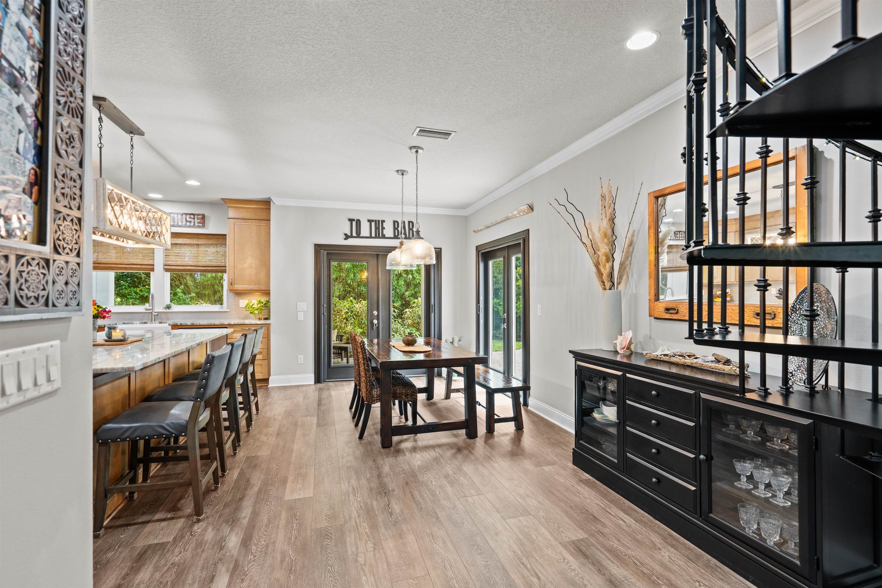 912 Sandy Beach Circle St. Augustine, FL 32080 - Photo 23 of 71 Dining space featuring light wood-type flooring, healthy amount of natural light, crown molding, recessed lighting, and a textured ceiling