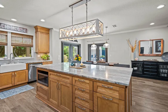 an aerial view of a house with outdoor space and sitting space