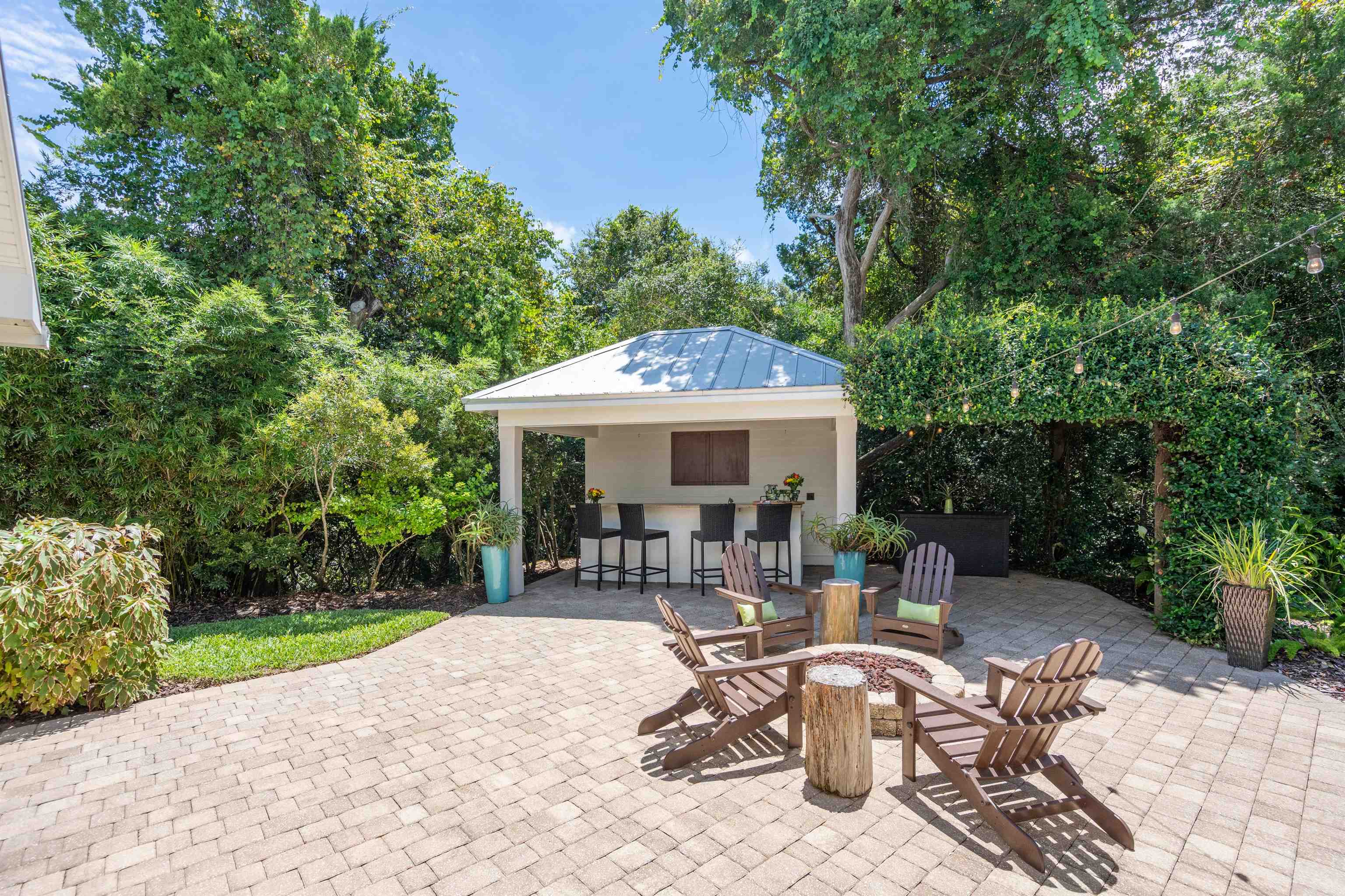 912 Sandy Beach Circle St. Augustine, FL 32080 - Photo 41 of 71 View of patio with an outdoor fire pit and view of scattered trees