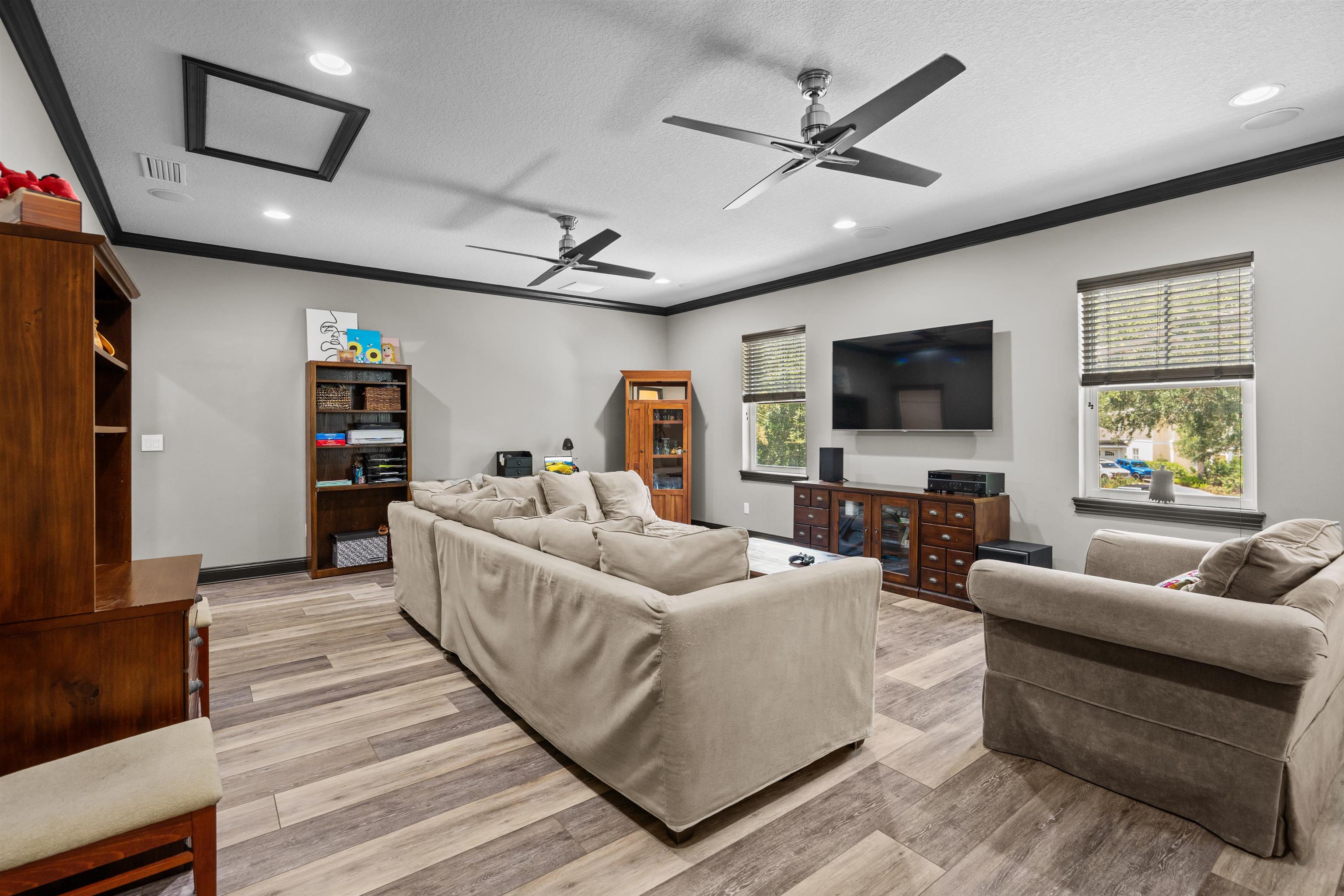 912 Sandy Beach Circle St. Augustine, FL 32080 - Photo 49 of 71 a living room with furniture and a flat screen tv