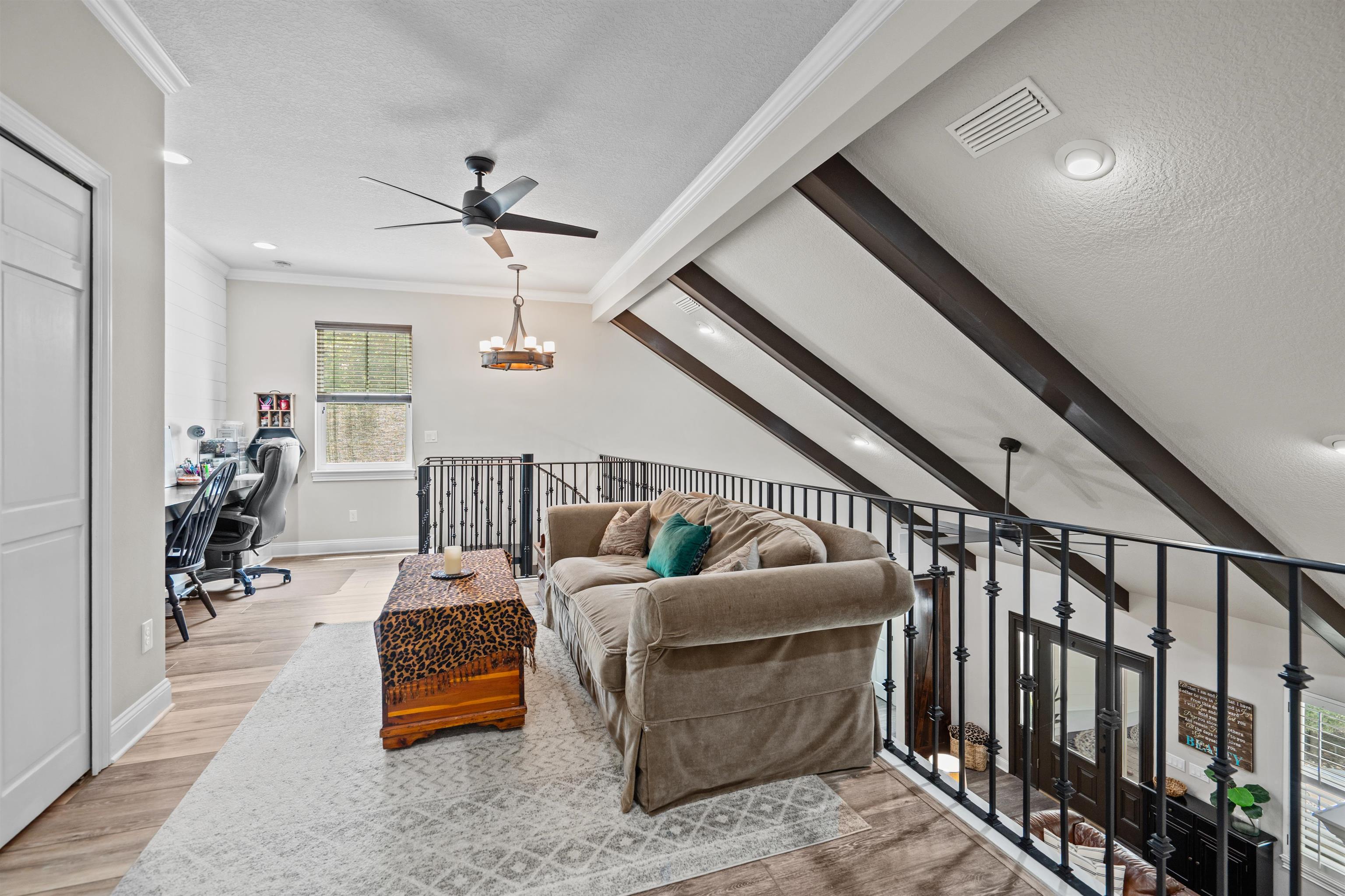 912 Sandy Beach Circle St. Augustine, FL 32080 - Photo 52 of 71 Living area with ornamental molding, an office area, a ceiling fan, a textured ceiling, and wood finished floors