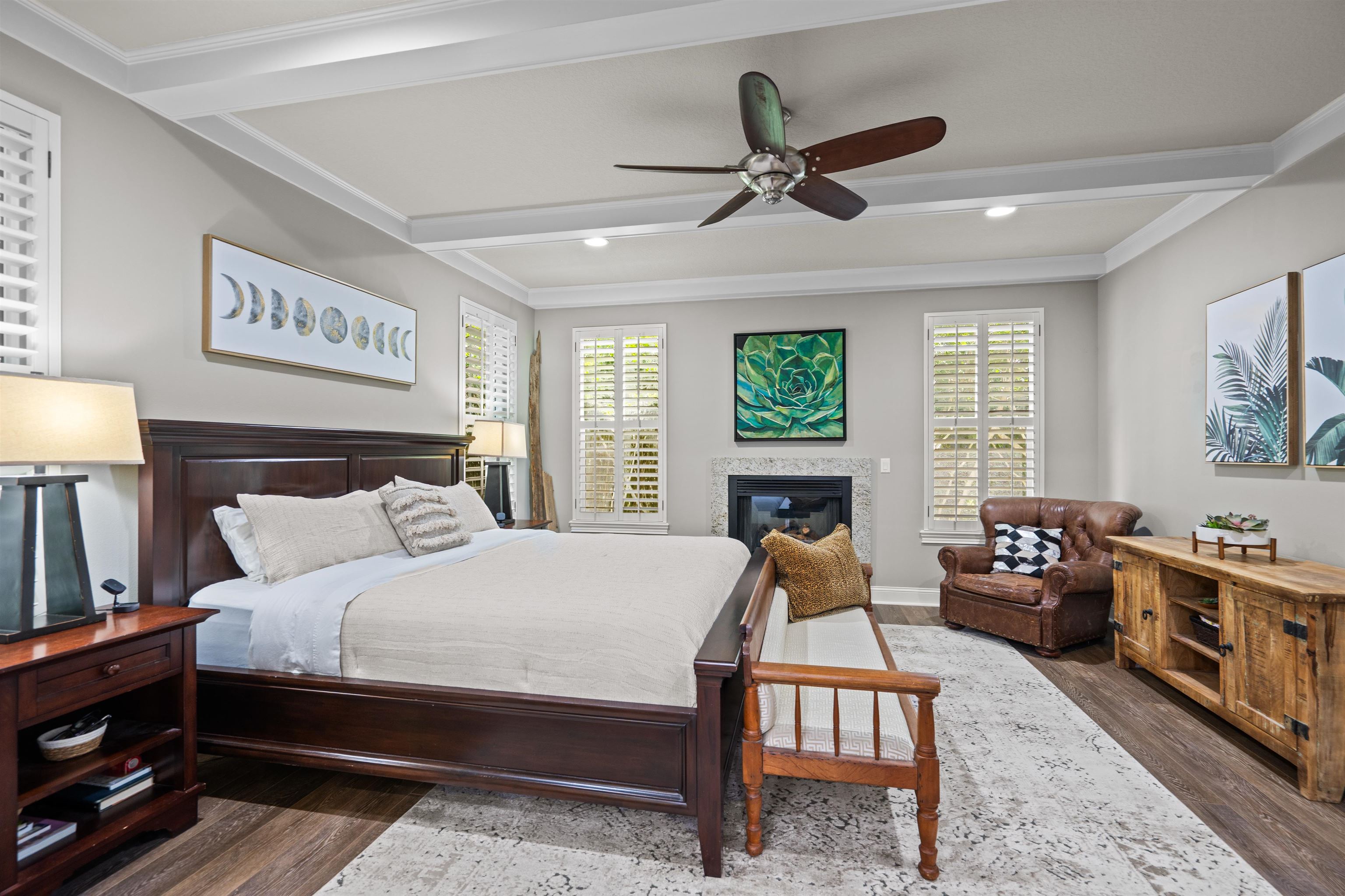 912 Sandy Beach Circle St. Augustine, FL 32080 - Photo 63 of 71 Bedroom with wood finished floors, beam ceiling, ornamental molding, a glass covered fireplace, and ceiling fan