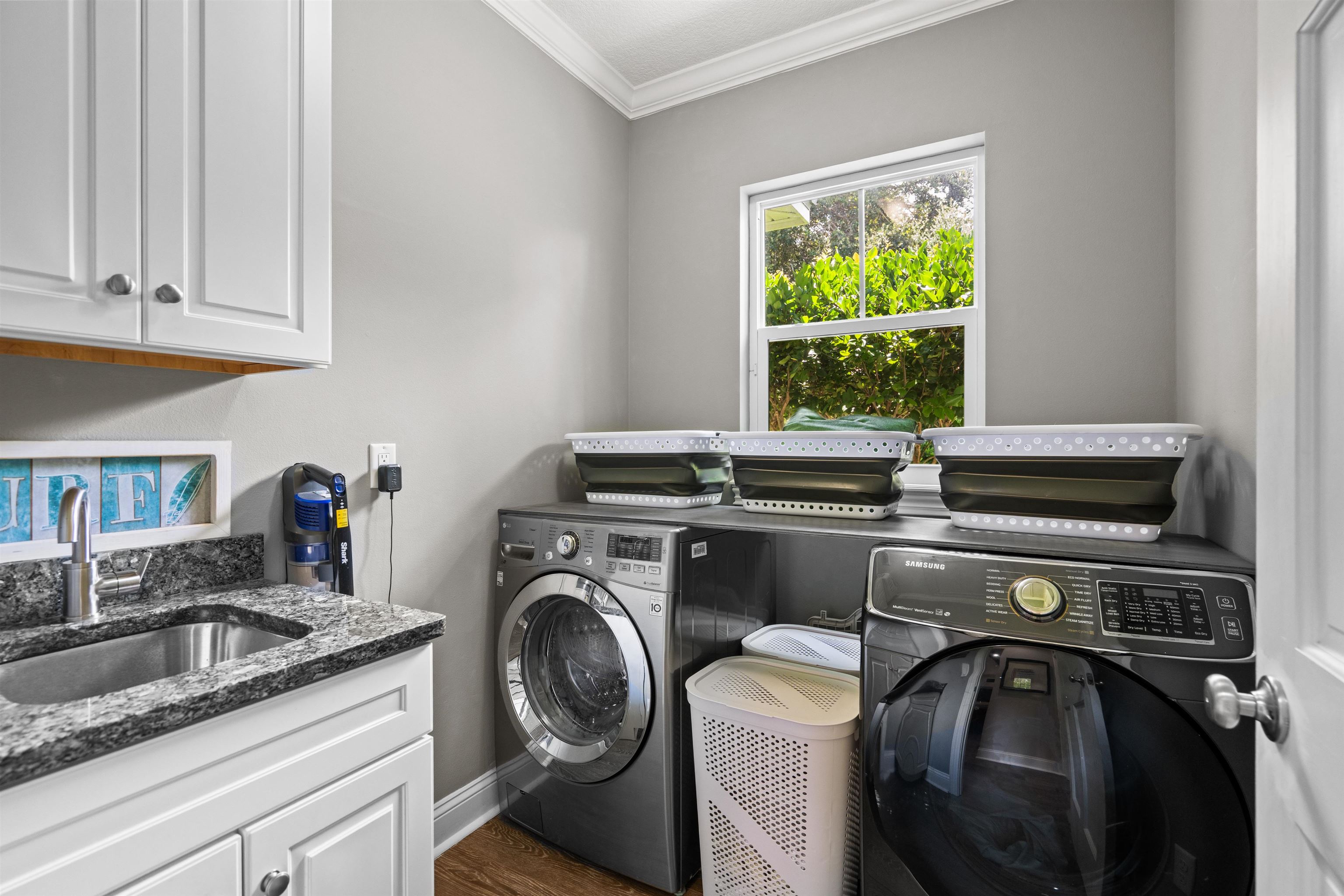 912 Sandy Beach Circle St. Augustine, FL 32080 - Photo 68 of 71 a view of a kitchen with washer and dryer