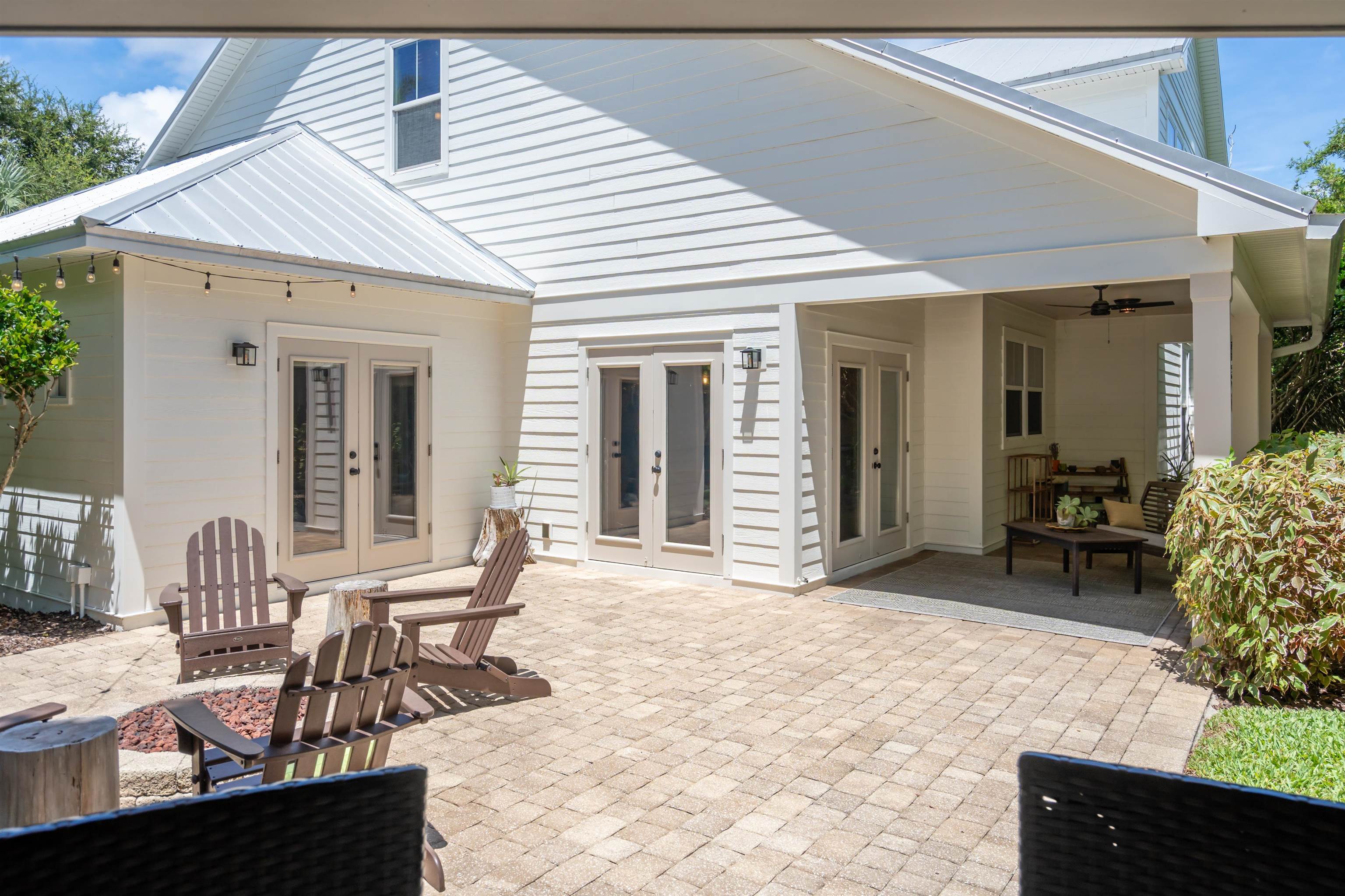 912 Sandy Beach Circle St. Augustine, FL 32080 - Photo 7 of 71 Back of house featuring french doors, a patio, ceiling fan, and a metal roof