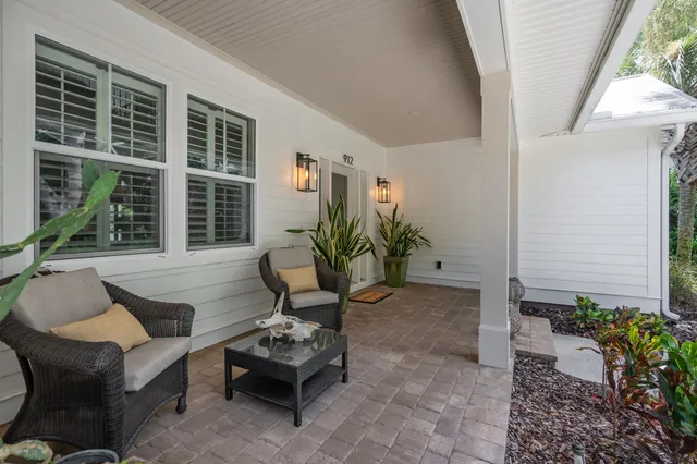 an aerial view of house with yard swimming pool and outdoor seating