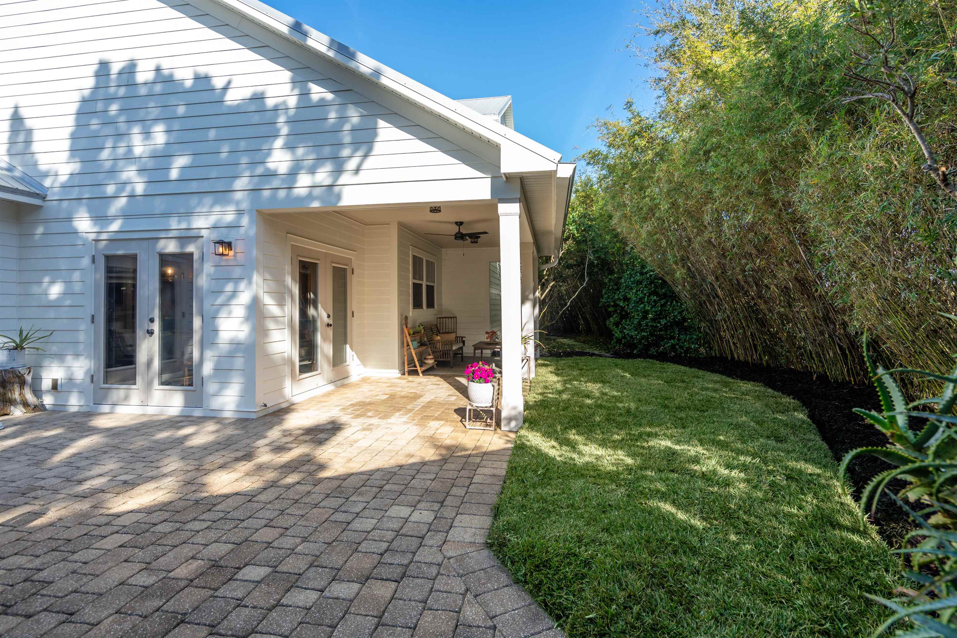 912 Sandy Beach Circle St. Augustine, FL 32080 - Photo 9 of 71 Rear view of property featuring a patio area, a yard, a ceiling fan, and french doors