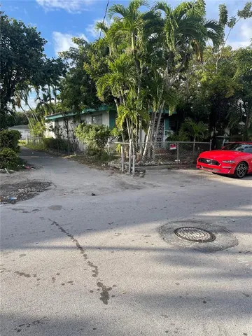 a backyard of a house with lots of green space