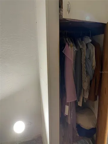 a bathroom with a mirror and a shower curtain