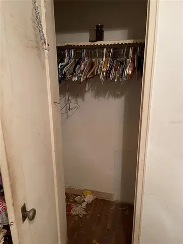 a bed sitting in a room next to a window