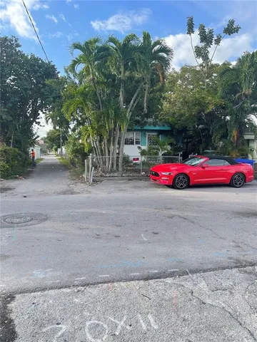 a view of a two chairs in the patio