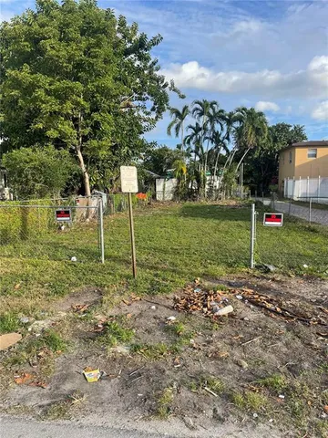 a view of a yard with trees