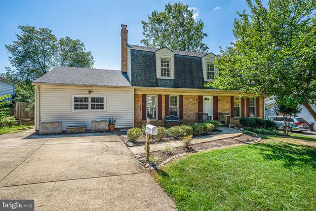 a front view of house with yard and outdoor seating