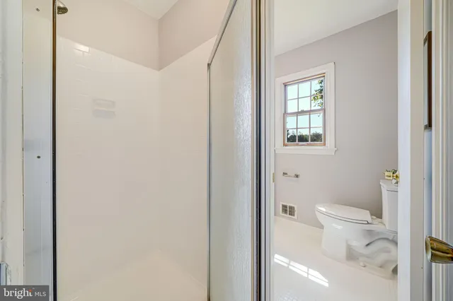 a bedroom with a bed and a table in it