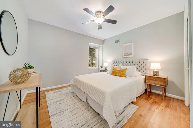 a bed with white sheets and a couch