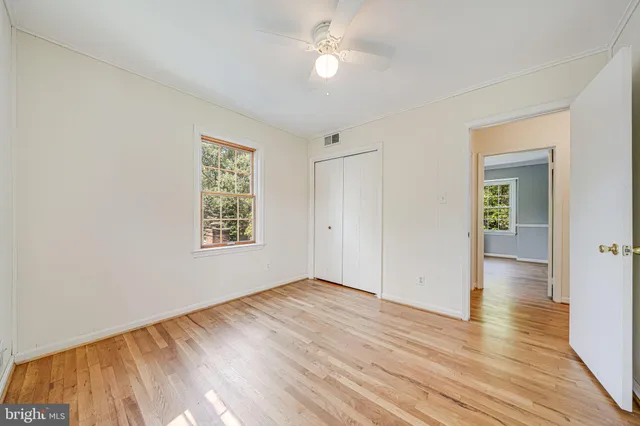a bathroom with a toilet a sink and a mirror