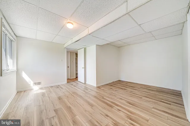 a bathroom with a sink shower and a mirror