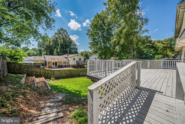 a view of a house with a backyard porch and sitting area