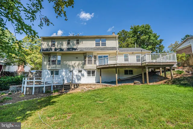 a front view of house with yard and outdoor seating
