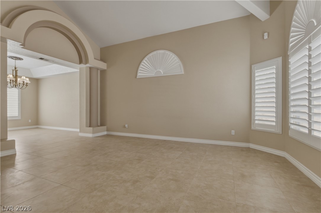 29 Olive Tree Henderson, NV 89074 - Photo 9 of 60 This expansive room features elegant arched entryways and durable tile flooring.