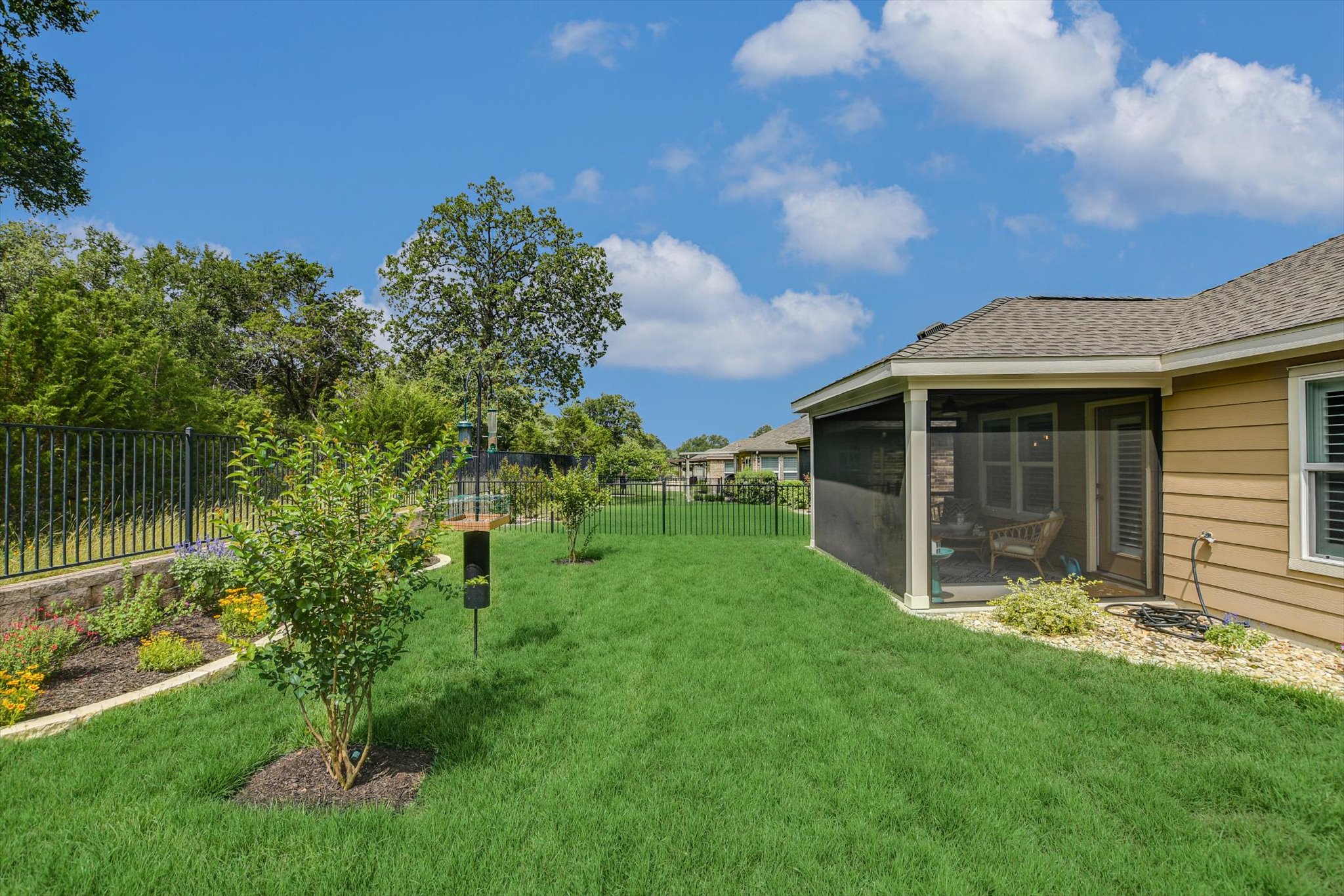 231 Hobby Street Georgetown, TX 78633 - Photo 26 of 29 A private, fenced backyard offers a serene escape with an inviting screened porch for relaxation.