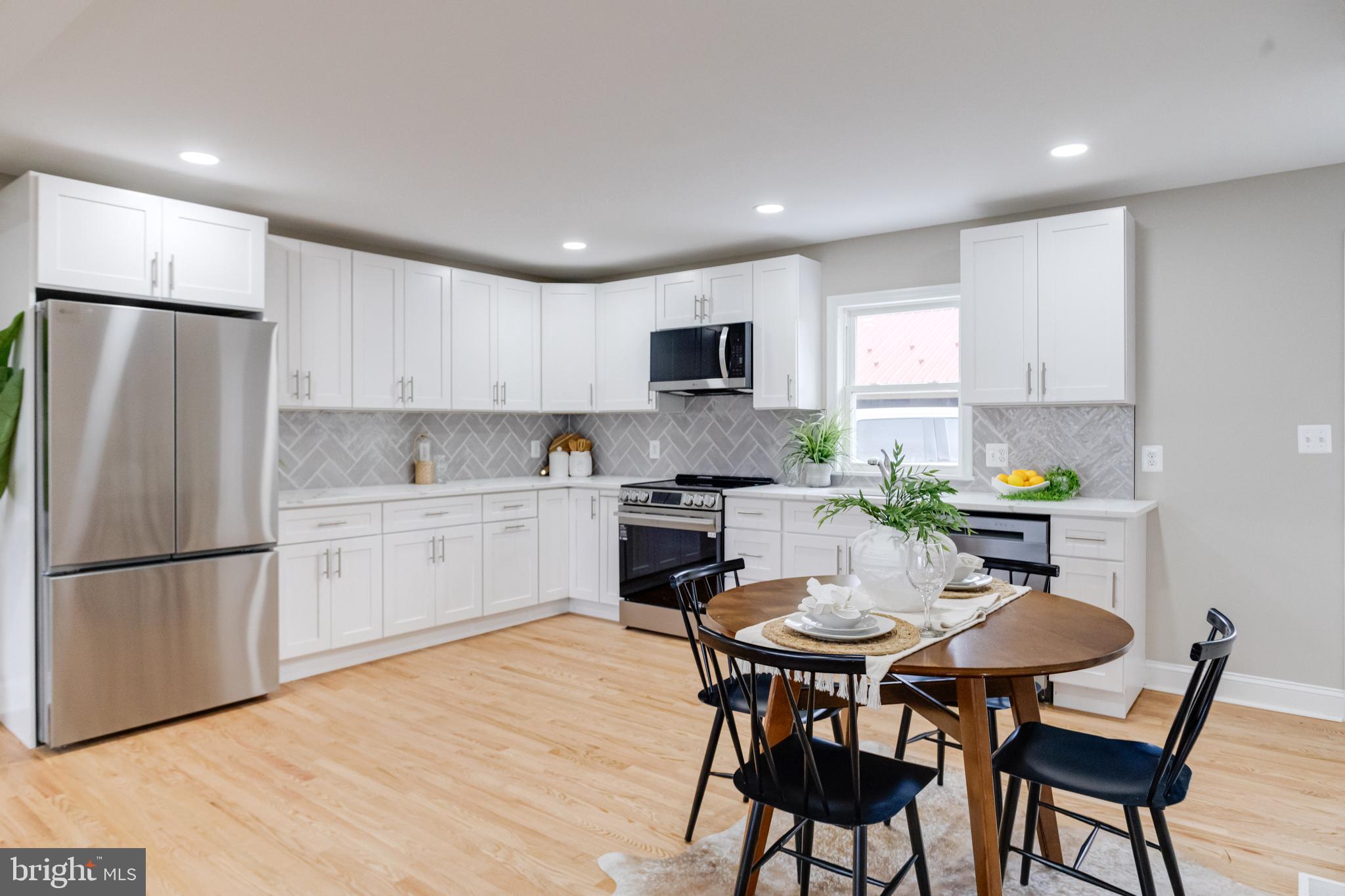 733 Reckord Road Fallston, MD 21047 - Photo 12 of 71 a kitchen with a dining table chairs and refrigerator