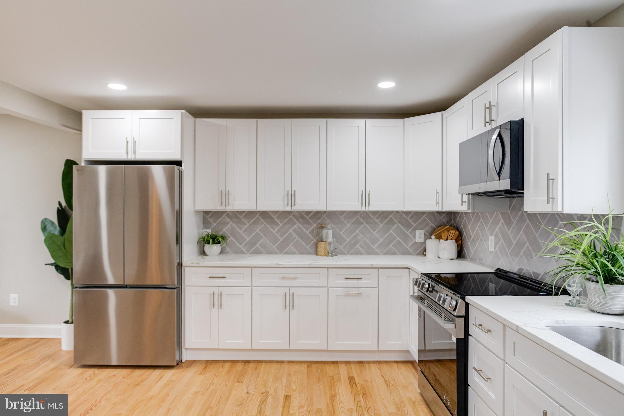 733 Reckord Road Fallston, MD 21047 - Photo 13 of 71 a kitchen with a refrigerator sink and white cabinets