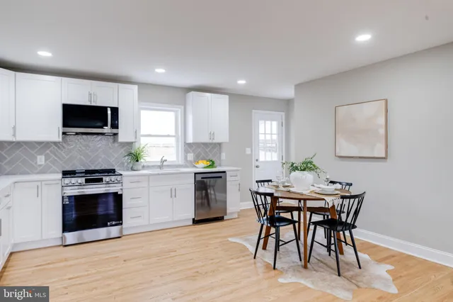 a bedroom with a bed and a potted plant