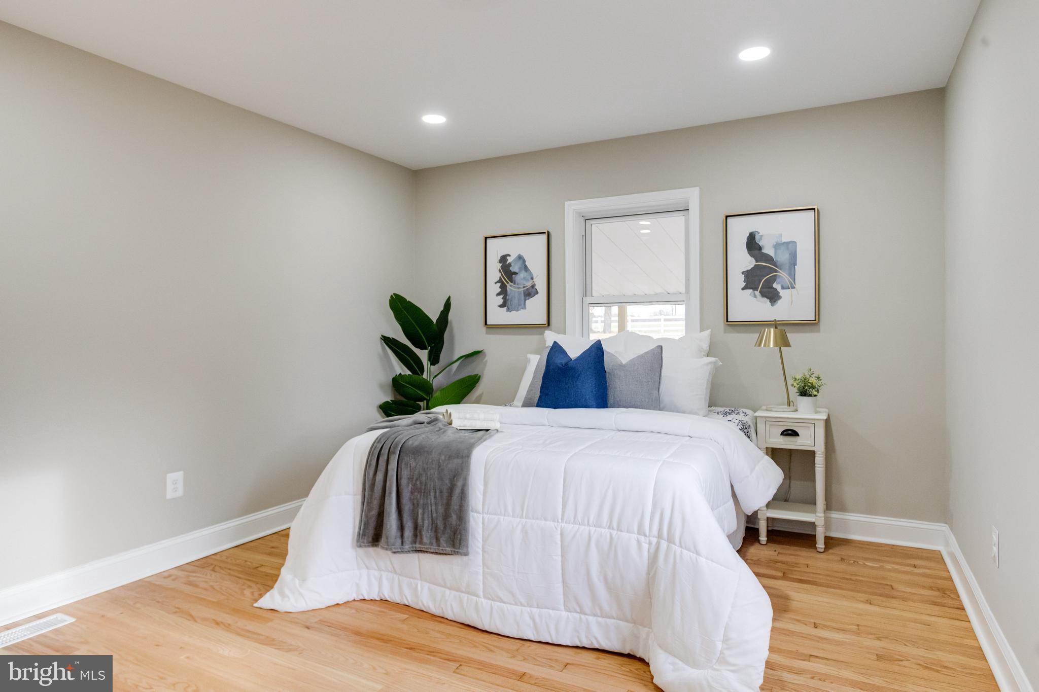 733 Reckord Road Fallston, MD 21047 - Photo 28 of 71 a bedroom with a bed and a painting on the wall