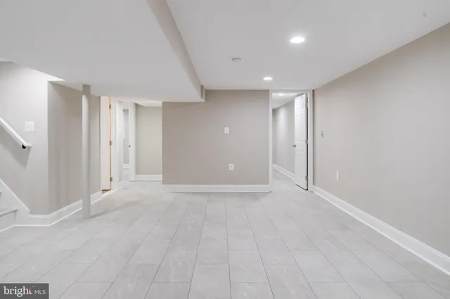 a white toilet sitting next to a bathroom sink