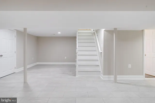 a bathroom with a shower and a window