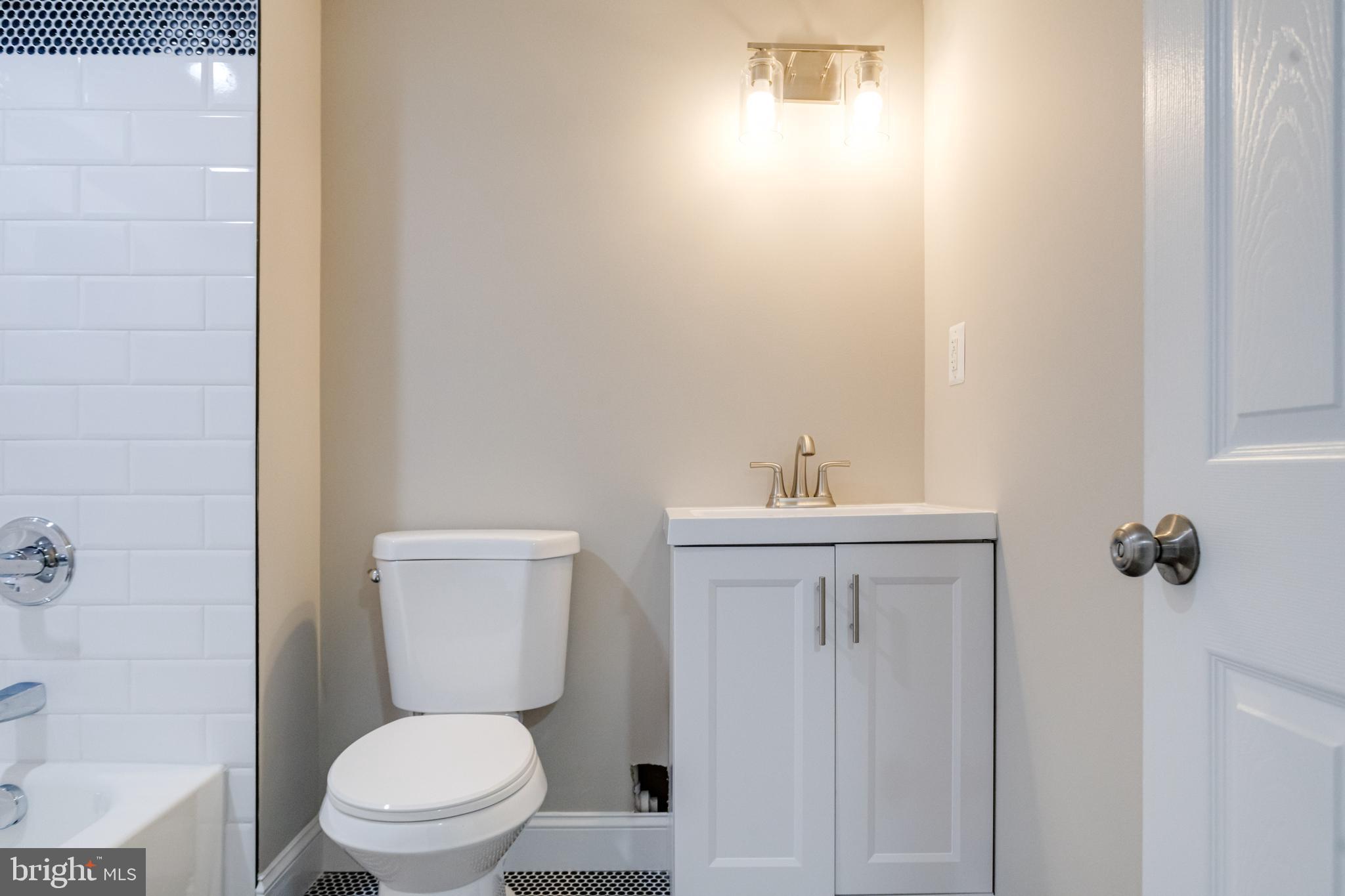 733 Reckord Road Fallston, MD 21047 - Photo 47 of 71 a white toilet sitting next to a bathroom sink