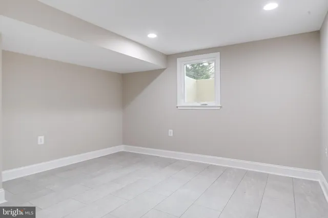 a palm tree sitting in front of a house with a yard