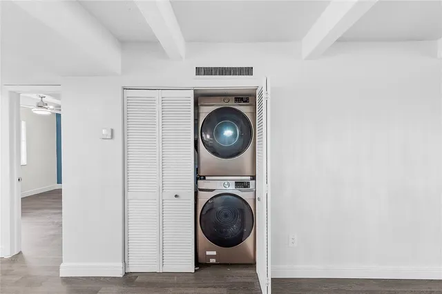 a view of a hallway with washer and dryer