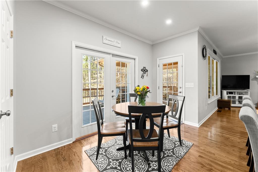 200 Morning Glory Ridge Canton, GA 30115 - Photo 15 of 88 a view of a dining room with furniture window and wooden floor