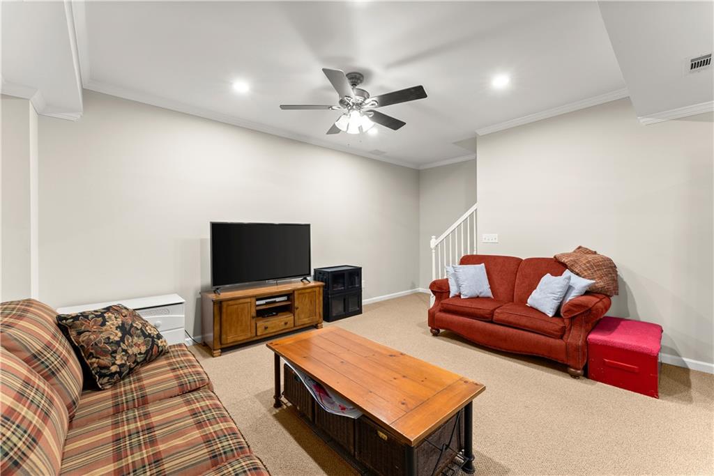 200 Morning Glory Ridge Canton, GA 30115 - Photo 25 of 88 a living room with furniture and a flat screen tv