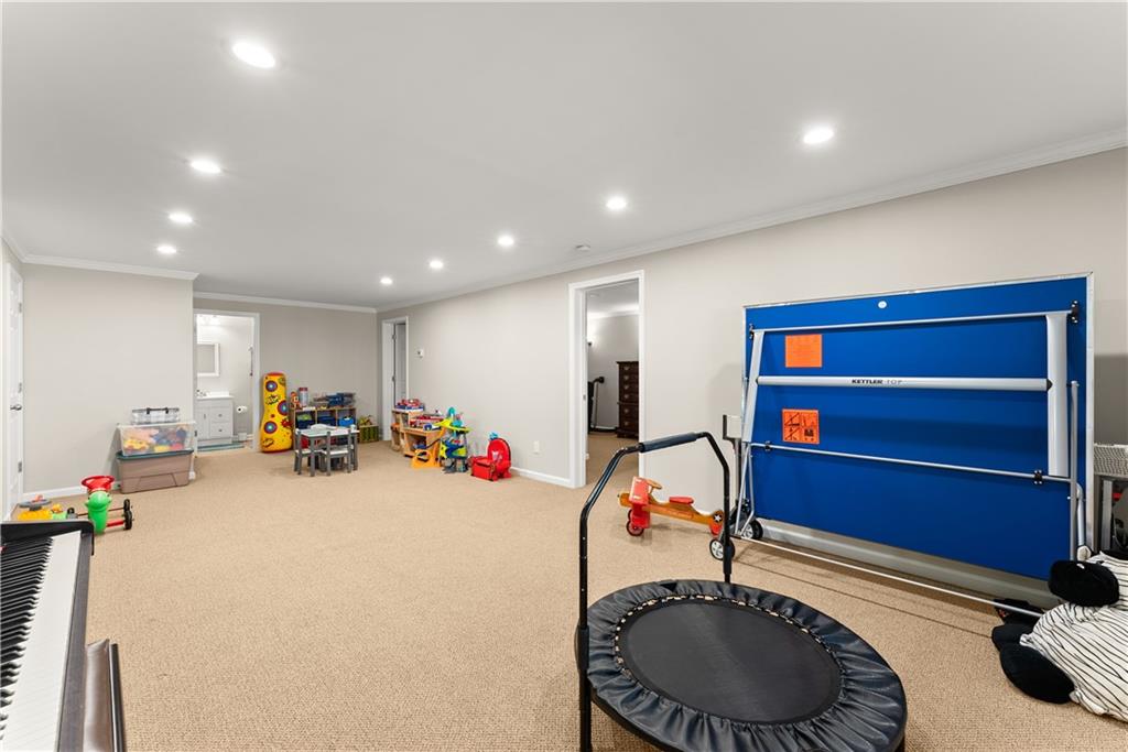 200 Morning Glory Ridge Canton, GA 30115 - Photo 26 of 88 a view of a room with gym equipment and toys