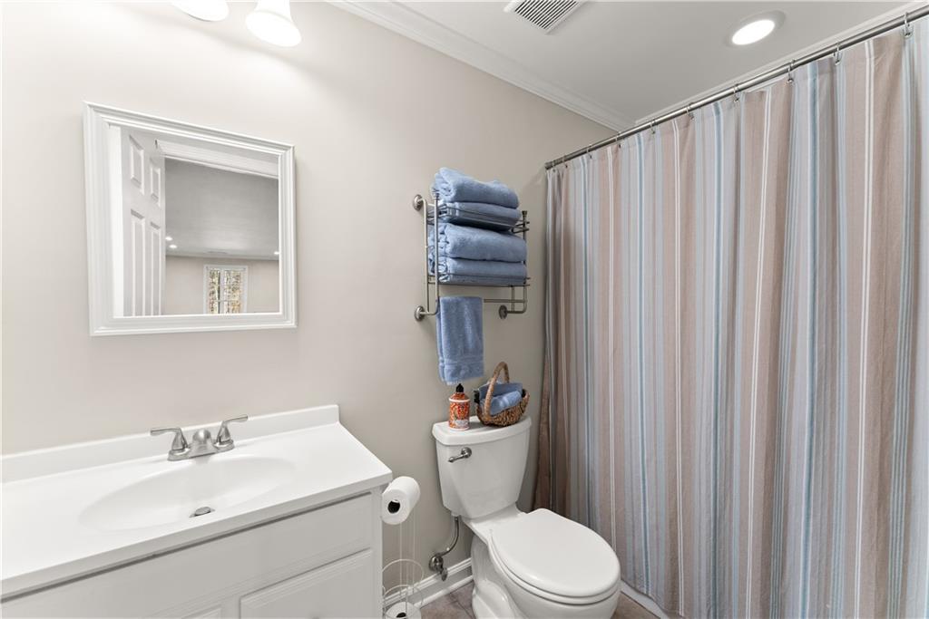 200 Morning Glory Ridge Canton, GA 30115 - Photo 28 of 88 a bathroom with a sink a toilet and shower