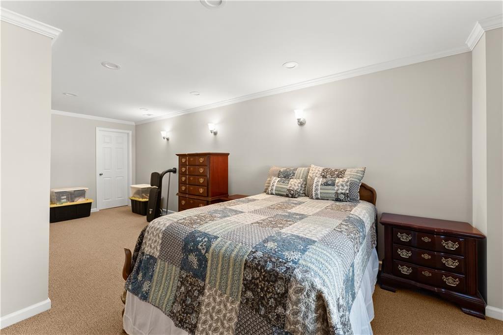 200 Morning Glory Ridge Canton, GA 30115 - Photo 29 of 88 a bed room with a bed and a tv