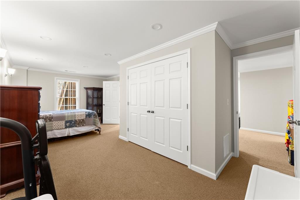 200 Morning Glory Ridge Canton, GA 30115 - Photo 30 of 88 a bedroom with furniture and a window