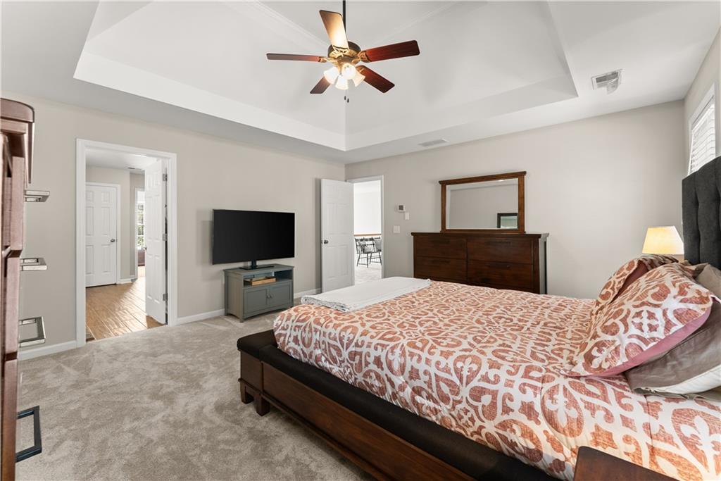 200 Morning Glory Ridge Canton, GA 30115 - Photo 37 of 88 a bedroom with a bed and a flat screen tv