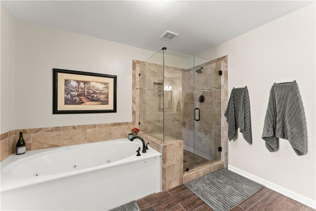 200 Morning Glory Ridge Canton, GA 30115 - Photo 39 of 88 a bathroom with a bathtub and a shower