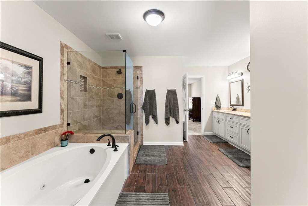 200 Morning Glory Ridge Canton, GA 30115 - Photo 40 of 88 a bathroom with a bathtub and a shower