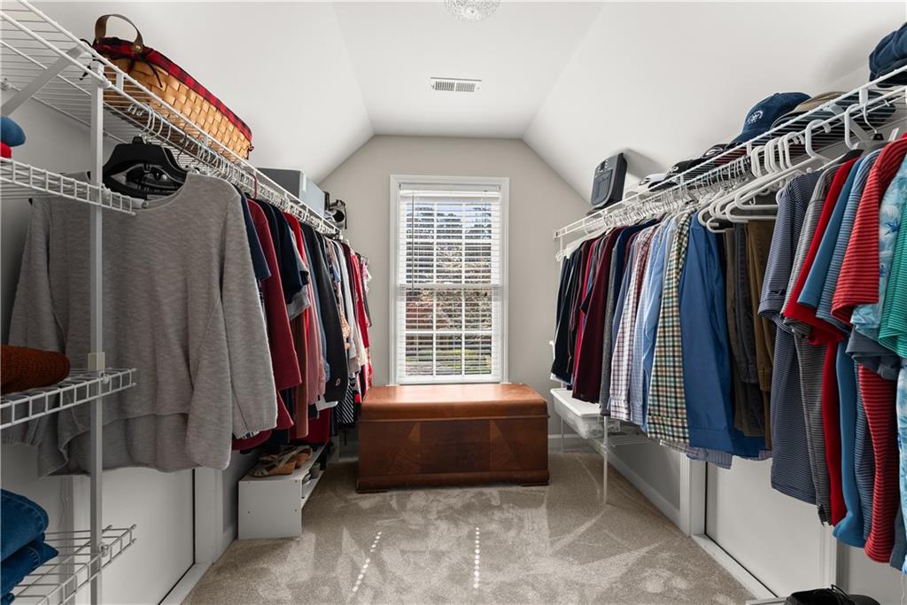 200 Morning Glory Ridge Canton, GA 30115 - Photo 41 of 88 a view of walk in closet with clothes and shoes
